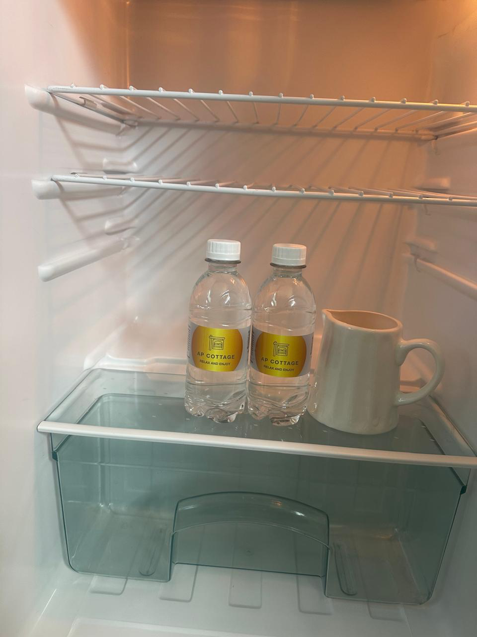 Fridge with complimentary water and jug